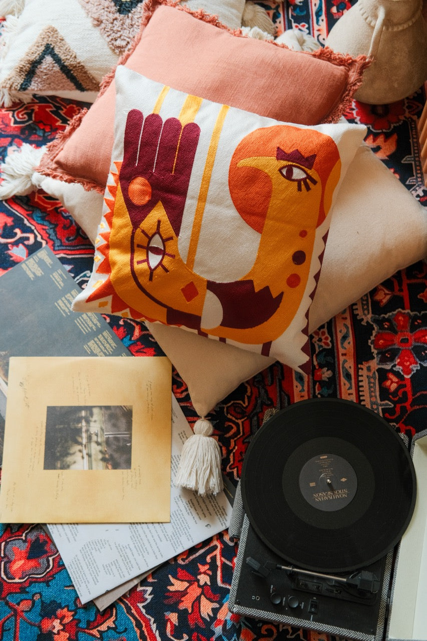 Sun bird tufted cushion