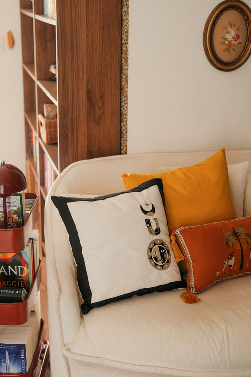 Golden trio embroidered cushion